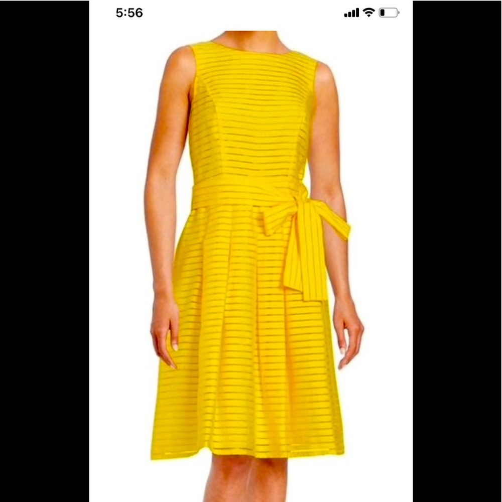 Yellow sleeveless knee length fit and flare design